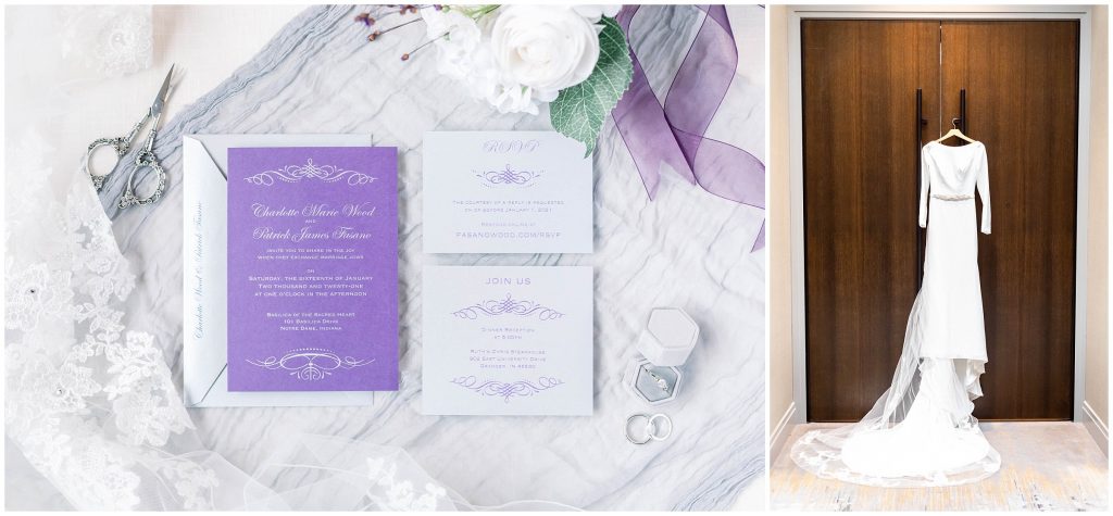 Purple and silver wedding invitation suite and bridal dress hanging on a door.